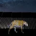 Under a luminous, star-studded Arizona sky, Alejandro Prieto projects the image of a Jaguar onto a section of the US–Mexico border fence to symbolise ‘the jaguar’s past and its possible future presence in the United States. If the wall is built, it will destroy the jaguar population in the United States. 