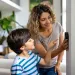 Mother and son check thermostat