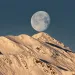 Low angle view of moon over the mountains   