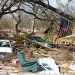 Cars, couches, and the wreckages of homes lay strewn amid fallen trees following Hurricane Katrina