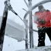A weather observer knocked ice and snow off of a device atop Mount Washington