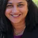 Portrait of Shruti Bhatnagar smiling at the camera.
