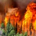 A wildfire menacing a southern Utah ski town for nearly a week flared again, doubling in size for the second night in a row and torching more homes after residents fled the flames