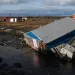 A home is left damaged in Kipnuk, Alaska, on a stream bank after the remnants of Typhoon Halong caused widespread destruction in the coastal village in Western Alaska, Friday, Oct. 17, 2025. (Marc Lester/Anchorage Daily News via AP)