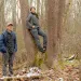 ressed for cold weather, Weston Lombard stands next to a tree and Molly Jo Stanley leans against it in a leafless-tree forest setting.