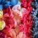 Fashion flowers of a collection lie in a cardboard box in the warehouse of the Steyer artificial flower manufactory. 