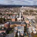 Wide aerial view of townscape with churches residential blocks and water tower in Frederick Maryland