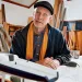 Tom Wylie in the workshop adjacent to his Canyon, California, home. The model in the foreground is of a Wyliecat 44. | Photo by Mitch Tobias