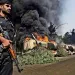 A fuel convoy bound to resupply NATO forces in Afghanistan burns after an attack by militants in Khyber Pakhtunkhwa Province, Pakistan.| ARSHAD ARBAB/EPA/Corbis