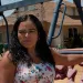 Fidelia Morales in her front yard. The orange groves around her house are frequently sprayed with pesticides. 