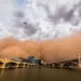 A huge haboob dust storm, a wall of brown, blows through downtown Tempe (Phoenix).