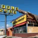 A Waffle House in Callaway, Florida, with a pole smashed through the roof after Hurricane Michael in 2018. 