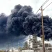 A large plume of black smoke rises into the sky from a fire at a petrochemical plant near Houston.