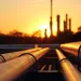 Crude oil refinery during sunset with pipeline connection