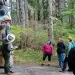 Ranger showing park guests a totem pole at Sitka National Historical Park.