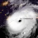 Hurricane Laura as seen from above is a massive swirl of white over Cameron, Louisiana.