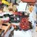 Food waste and boxes piled beside a brick wall