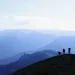 Veterans hike through mountains.