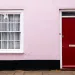 A pink house with no people outside.
