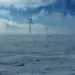 wind turbines in snowstorm