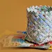 Chart a new course for your paper maps by weaving them into a sturdy, multihued basket