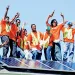 Graduating trainees at Solar Richmond, a green-collar job program in California's Bay Area, celebrate a successful installation.
