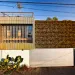 The master bedroom of the Venice, California, family home is swathed by a living wall on three sides and topped with a green roof.
