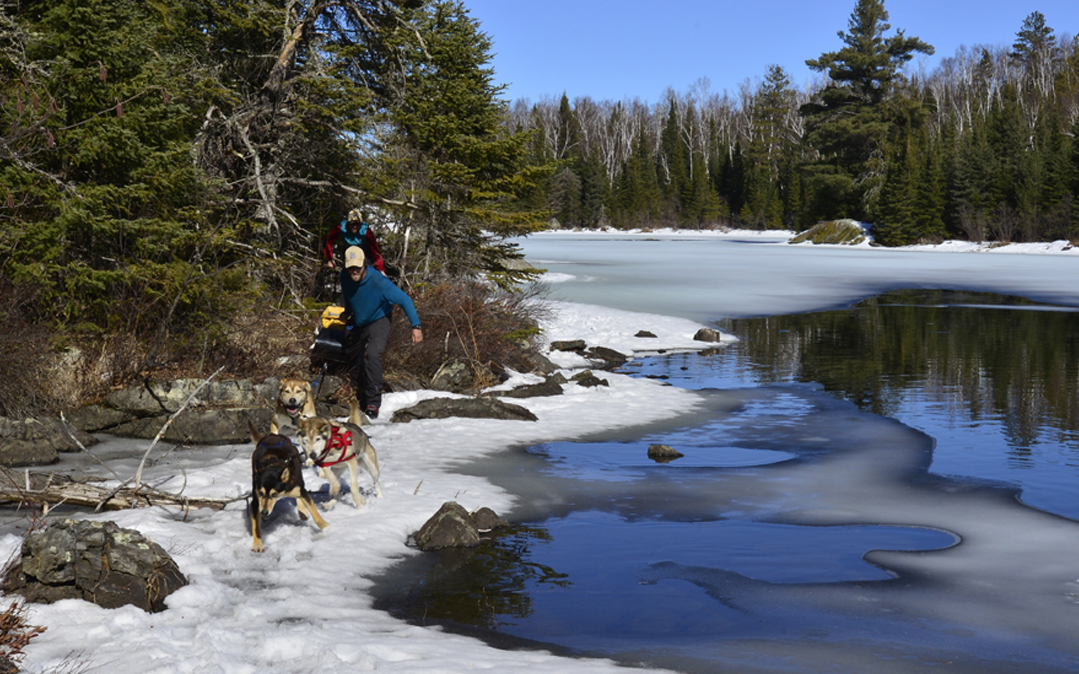 Open water and bright sun make for challenging travel conditions through a series of ponds en route to Moose Lake.