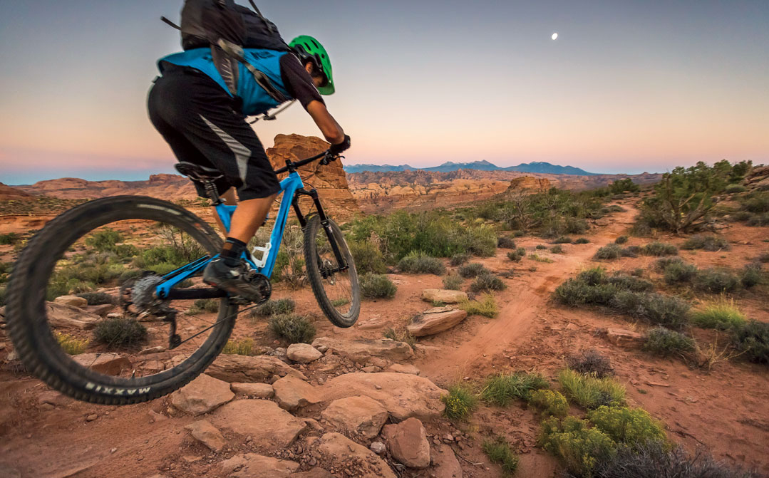 A mountain biker on the Hymasa trail in Moab, Utah.