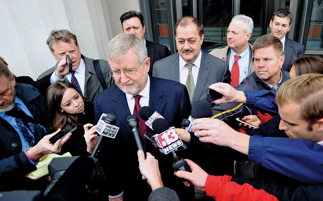 Former Massey Energy Chief Executive Don Blankenship walks behind his attorney Bill Taylor (C) as they are met with media outside the Robert C. Byrd U.S. Courthouse in Charleston, West Virginia December 3, 2015. 	yes/perm	Former Massey Energy CEO Don Blan
