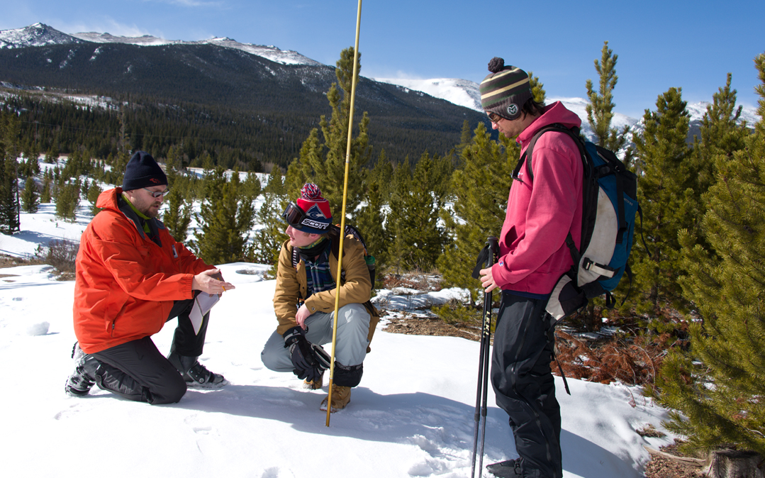 Colorado State University faculty and students conduct field research to measure snowpack at the CSU Mountain Campus.