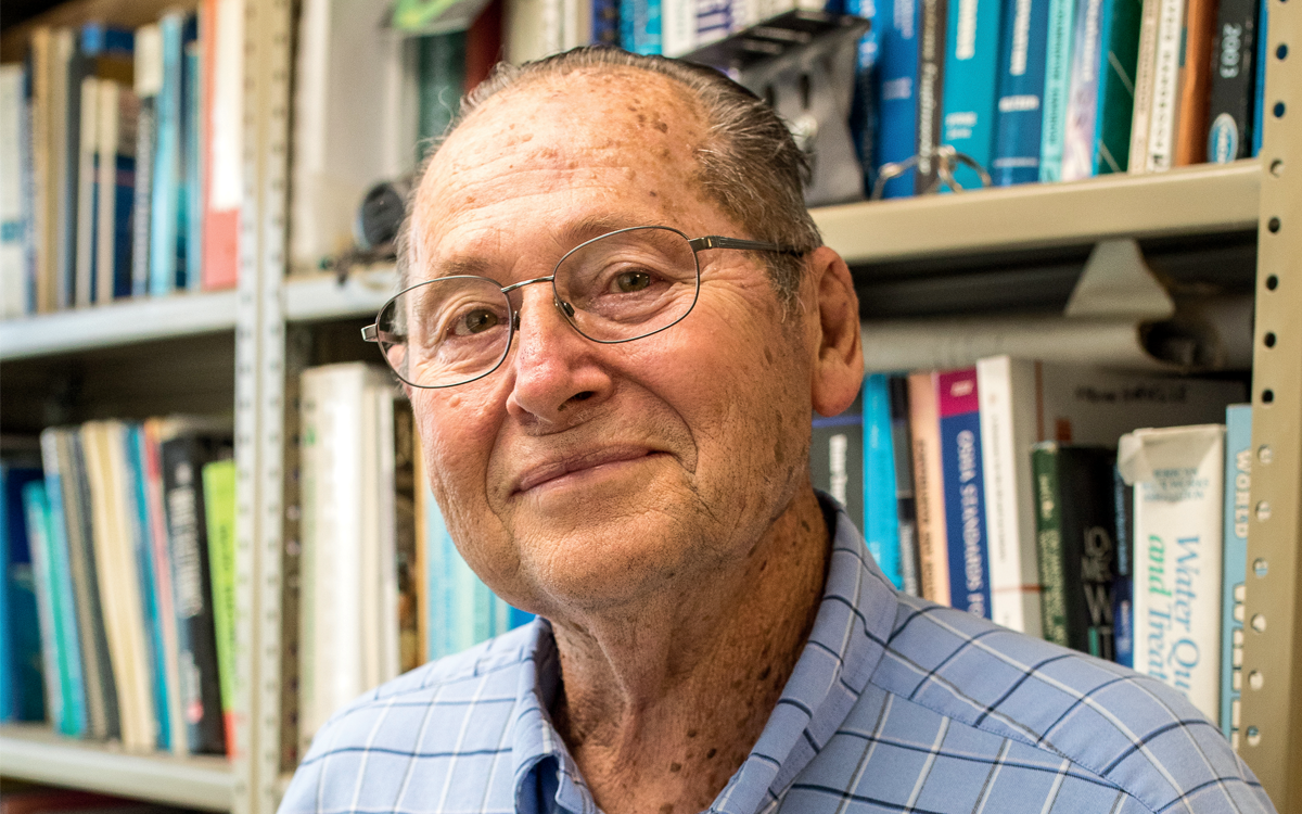 Norman Norvelle in his office at home. 