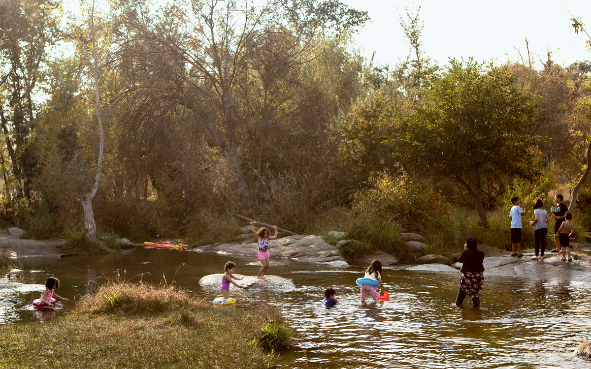 Children swim in a shallow part of the San Joaquin River at Lost Lakes Recreation area near Friant Dam.