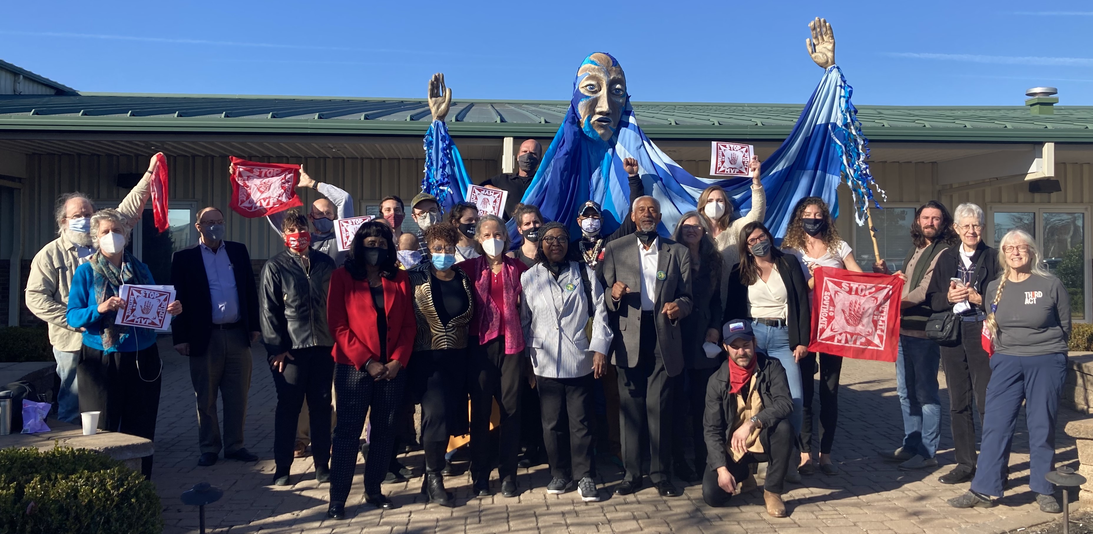 Activists protest outside a Mountain Valley Pipeline hearing