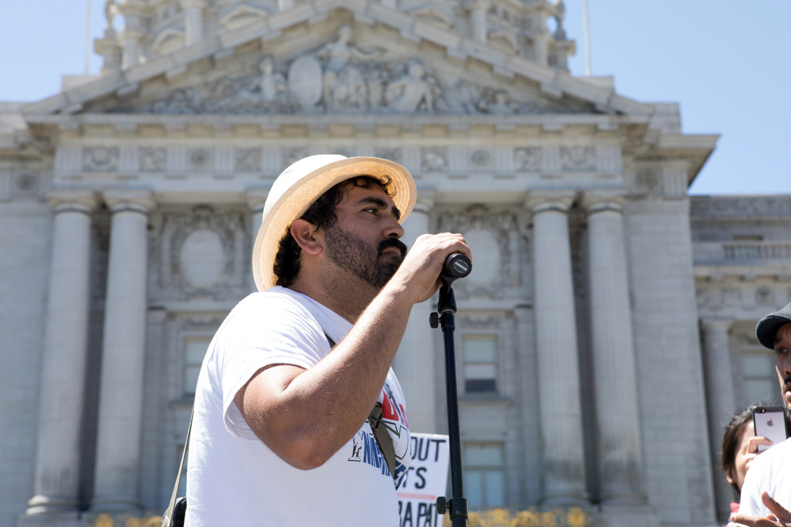 Frank Lara speaks at May Day protest. Photo by Sam Murphy.