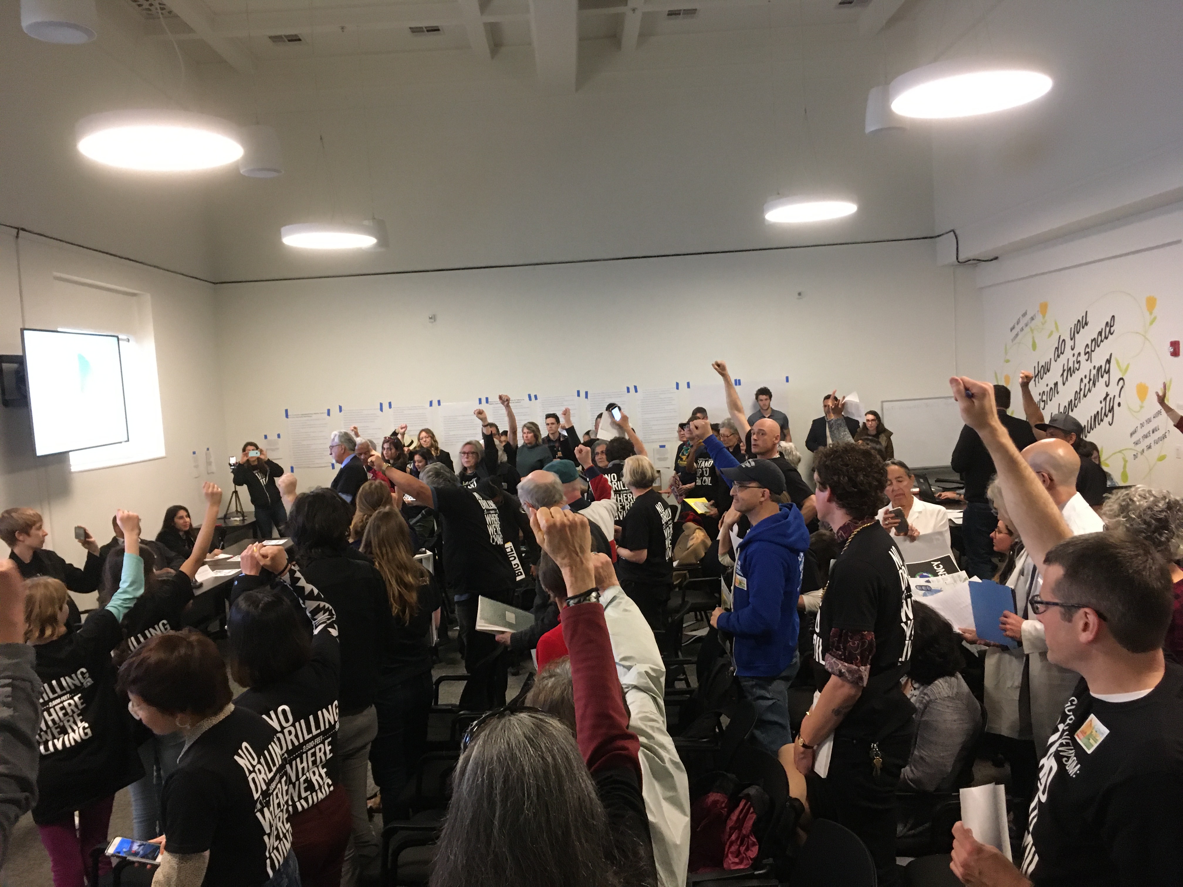 People at a public workshop show their support for oil and gas setbacks.