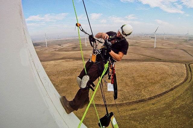 Ryan Gaunt snaps a photo of a turbine blade as part of a routine inspection in the Sacramento Delta.