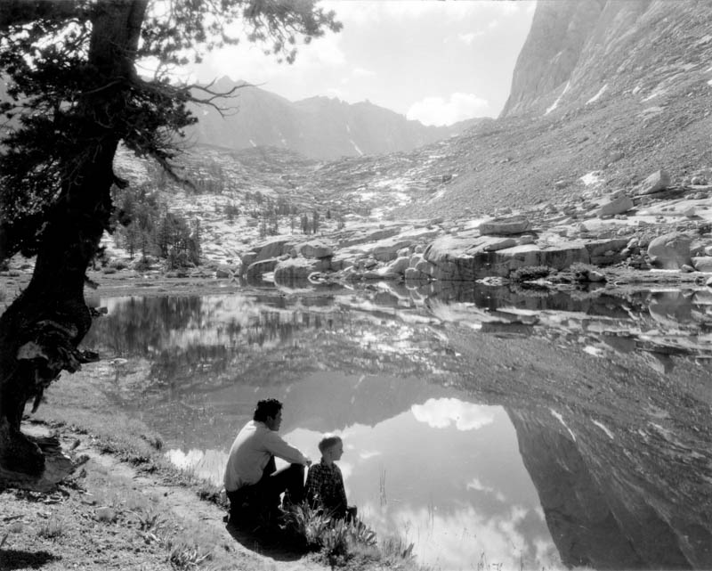 Two figures at lake