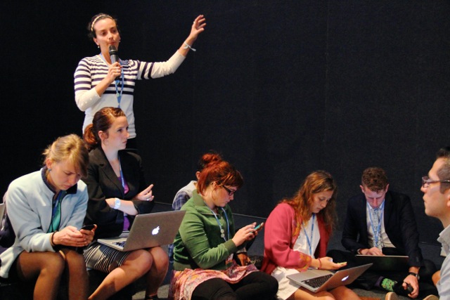 Youth participating in Spokescouncil during the YOUNGO constituency meeting on Young and Future Generations Day