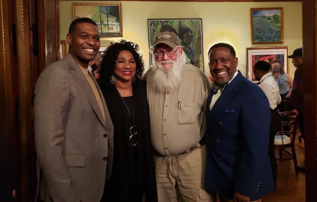 EPA Administrator Michael Regan poses for a picture with Darryl Malek-Wiley and environmental justice leaders.