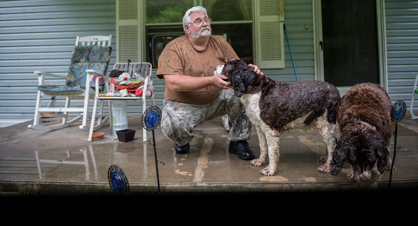 "Look up there what it looks like," Charles Bella said of the mountaintop-removal mine near his home in Blair, West Virginia. "It's been 12 years now since that's been reclaimed, and it still looks like a bomb hit it." | Ami Vitale/Panos Pictures