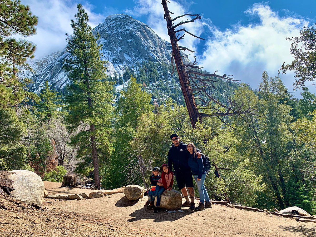 Sierra Club staff member Mary Lunetta hiking with her family at the base of Tahquitz Rock near their home in Idyllwild, California