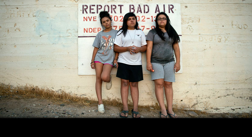 Aaliya, Ayona, and Zayda Hernandez near their home on the Moapa Band of Paiutes Reservation, about an hour north of Las Vegas. Since 1965, coal ash from the Reid Gardner Generating station has been dumped into uncovered ''ponds'' less than a half-mile fro