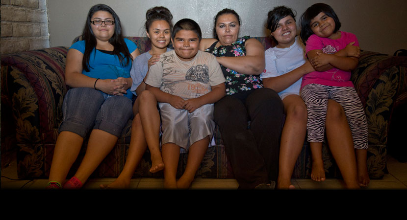 From left: Zayda, Aaliya, Gyiel, Surita, Ayona, and Ayashe Hernandez at their home on the Moapa Band of Paiutes Reservation. "When it's windy, you can feel it and taste it -- the dust. I guess it's the ash," Surita said. "When it comes, we usually don't g