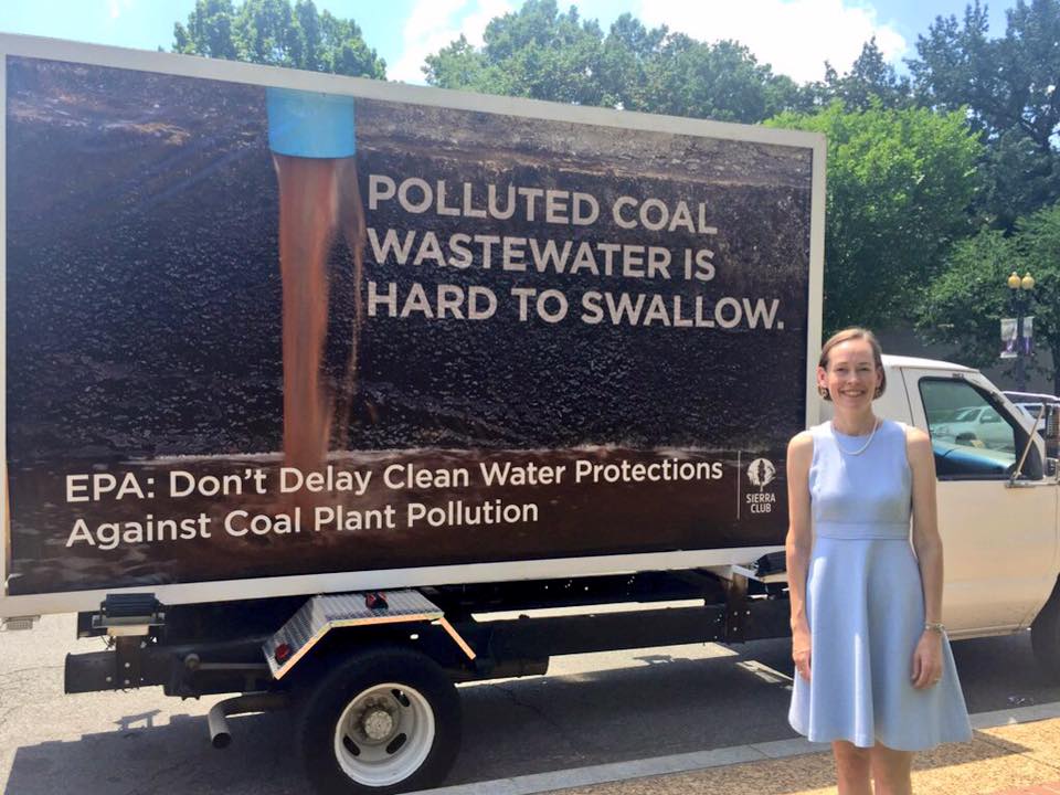 Mary Anne Hitt stands by the mobile billboard at the EPA hearing.