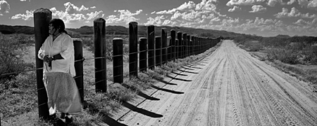 Ofelia Rivas stands on the land the O'Odham have inhabited for millenia, which spans the US-Mexico border.