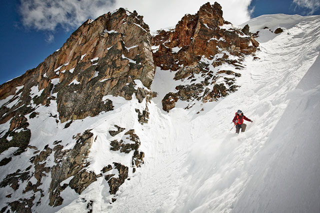 Ryan Krueger carefully carves his way down the 50-plus-degree upper section of the couloir Resurrection