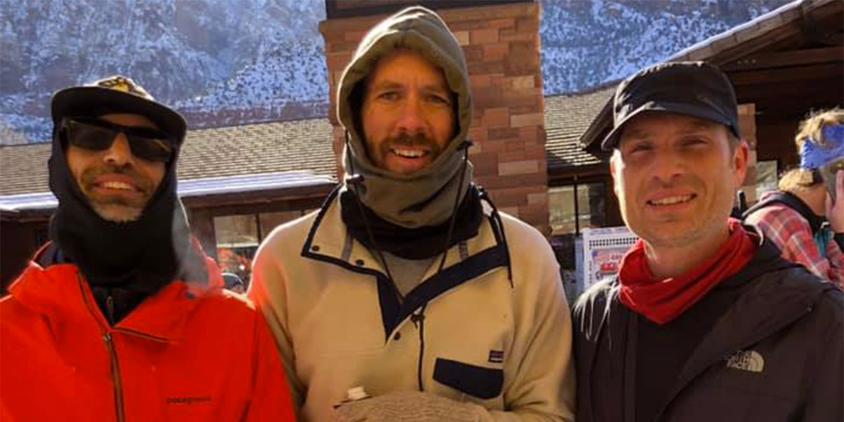 James, Ryan, and Adam, all from Los Angeles, bundled up to keep warm after their quick finish.