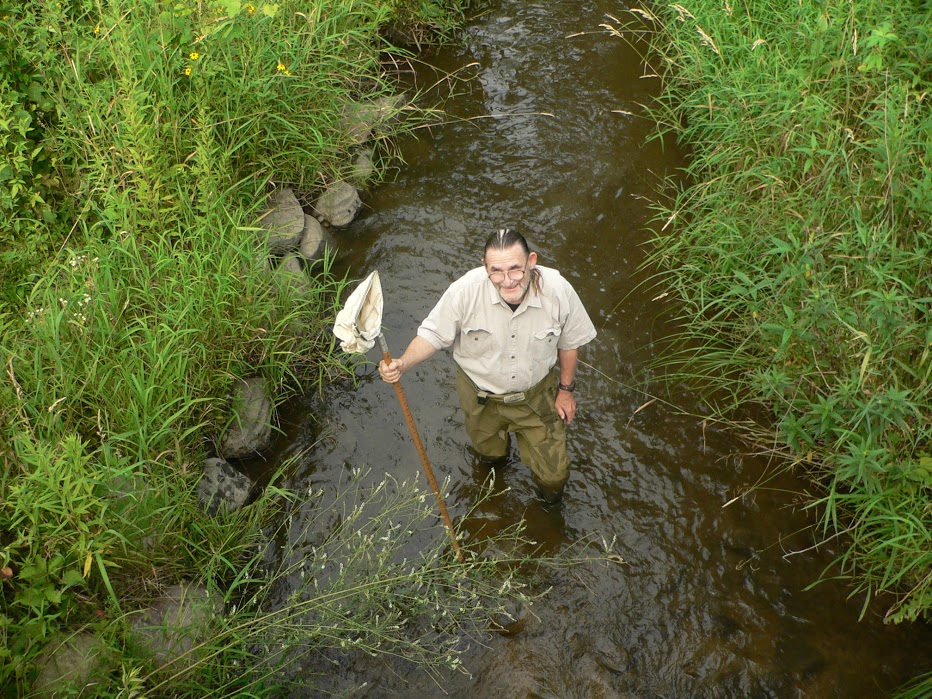Standing knee deep in water