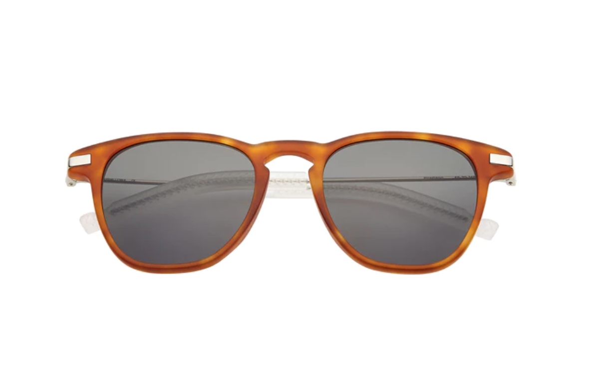 Tortishell framed sunglasses on a white background.